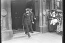 Sir Winston Churchill striding out from the entrance of Vickers in September 1915