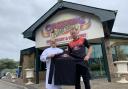 n Caspian Flame Grill owner Sohrab Padidar-Nazar and Workington Reds manager Danny Grainger show off the club’s new sponsored training kit