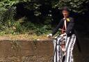 Whitehaven Carnival day 

Street entertanier puts his stlits on and heads for the carnival on his byscycle   Pic Greg lucas