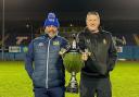 Workington Town head coach Anthony Murray and Whitehaven head coach Jonty Gorley holding the Ike Southward Memorial Trophy at The Fibrus Community Stadium