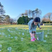 A young girl helps to set up the labyrinth