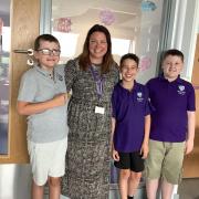 Headteacher Sophie McCabe meets pupils Aiden Bell (from left), Joey Nawrockyj and Jack Watson for the first time