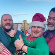 John Bond, Phil Todhunter and George Suafoa at the 'Fat Lads Dip' on New Year's Day