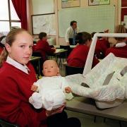 Claire McConvey 14 from Ehenside school, Cleator Moor with mechanical doll which shows children what it is really like living with a baby.
IAN COOPER
WEST COPY Claire