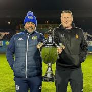 Workington Town head coach Anthony Murray and Whitehaven head coach Jonty Gorley holding the Ike Southward Memorial Trophy at The Fibrus Community Stadium