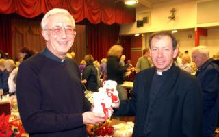 Revd Ron Bowlzer and Father Emmanuel Gribben enjoy a look around the stalls at Cleator Moor Civic Hall on Saturday at St Leonards church fair.pic John Story