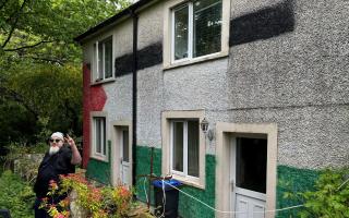 Kevin Blacklock has painted the Palestinian flag on the outside of his Distington home