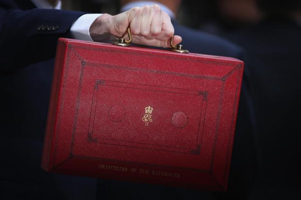 LONDON, ENGLAND - MARCH 16:  British Chancellor of the Exchequer, George Osborne carries the Budget Box outside 11 Downing Street on March 16, 2016 in London, England. Today’s budget will set the expenditure of the public sector for the year