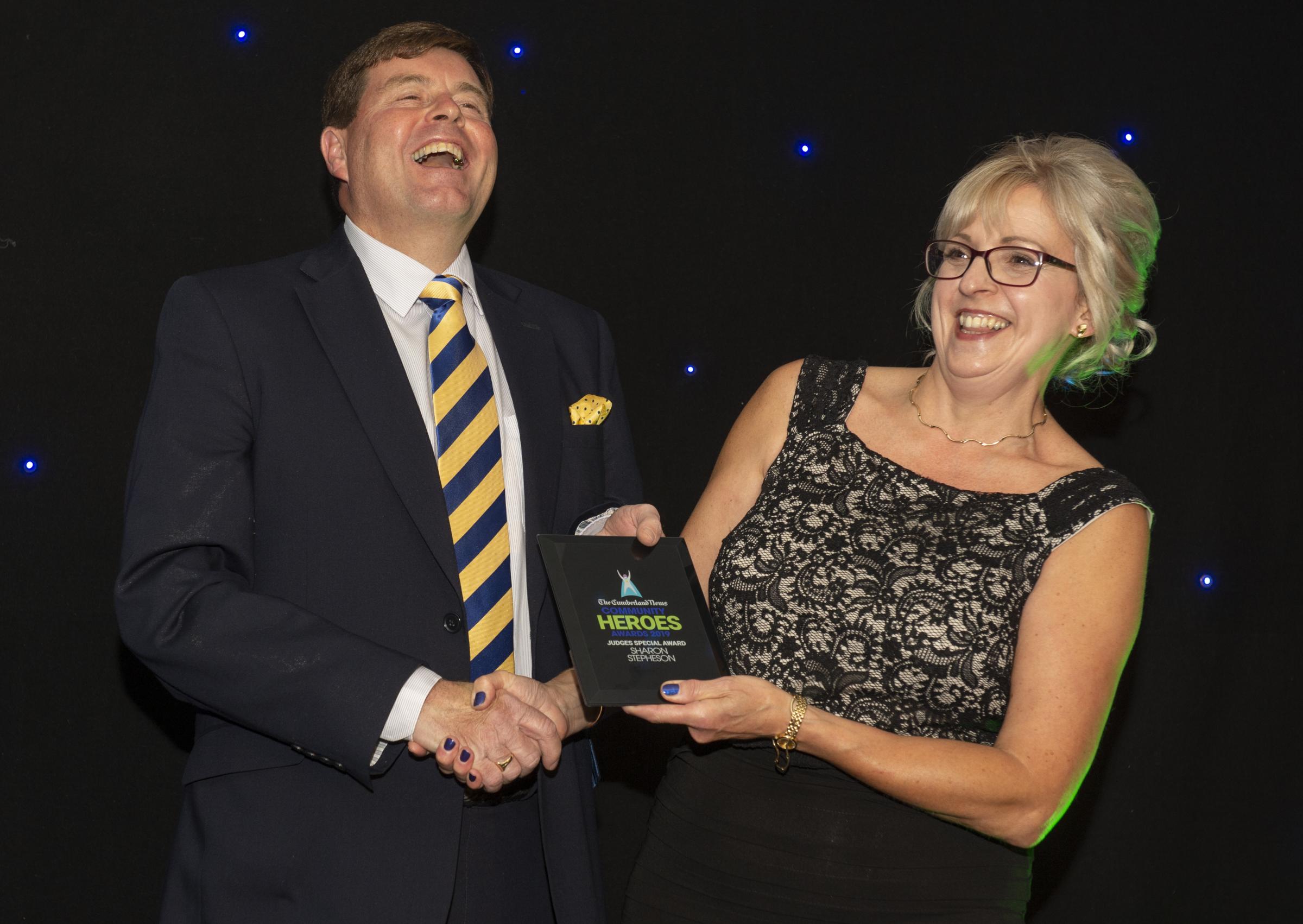 SMILES: Sharon Stephenson receives the judge’s special award from Peter McCall at Carlisle Racecourse in 2019. Picture: Jonathan Becker, info@beckerphoto.co.uk