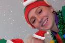 Christmas elves, Jake and Gracebring cheer to one of their clients