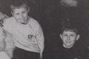 Hexham 1st beaver Sean Irving and cub scout Kieran Irving take a break from sorting donations for Kosovon refugees in 1999