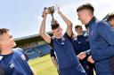 Carlisle United Community Sports Trust Football Development team are presented with their trophy for winning the EFL League Championship trophy at Brunton Park in Carlisle. ..Midfielder James Best has fun with team-mates....MONDAY 10th JUNE 2019. DAVID