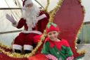 Santa and his elves at the Christmas markets