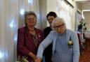 CELEBRATE: Joan Mossop cuts the Diamond Anniversary celebration cake