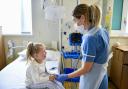Paediatric Nurse Kimberly Scott on Children’s ward West Cumberland Hospital with young patient.