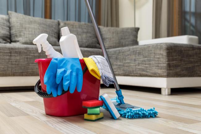 Cleaning service. Bucket with sponges, chemicals bottles and mopping stick. Rubber gloves and towel. Household equipment..
