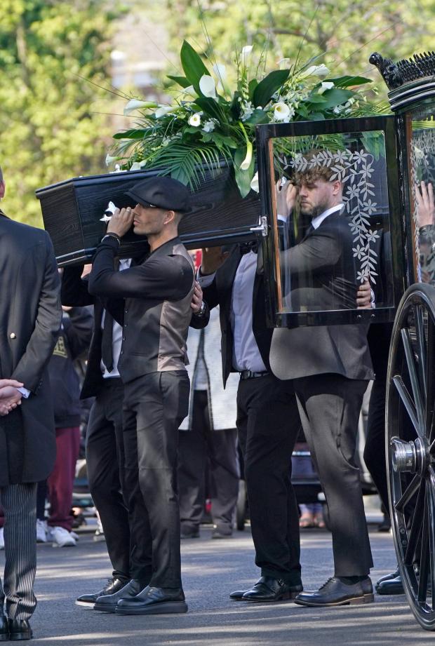 Whitehaven News: Max George and Jay McGuiness of The Wanted carry the coffin at the funeral of their bandmate. (PA)