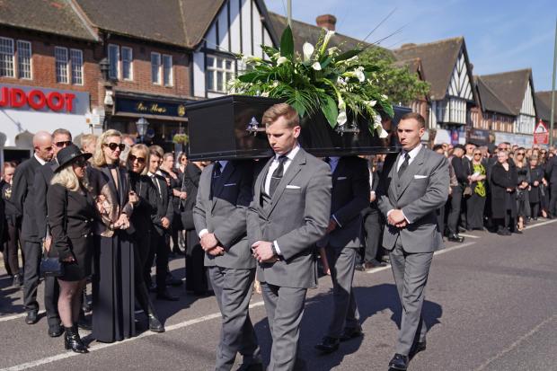 Whitehaven News: The coffin of The Wanted star Tom Parker is carried ahead of his funeral. (PA)