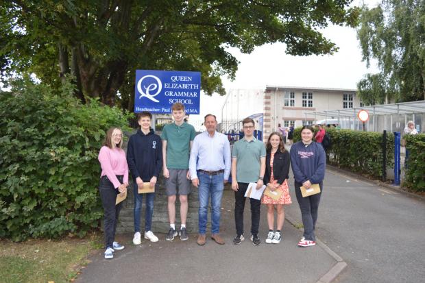 Students and the headteacher, Mr Buckland, celebrate the results. Credit: QEGS Penrith.