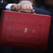 LONDON, ENGLAND - MARCH 16:  British Chancellor of the Exchequer, George Osborne carries the Budget Box outside 11 Downing Street on March 16, 2016 in London, England. Today’s budget will set the expenditure of the public sector for the year