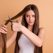 A Generic Photo of a woman cutting her own hair.  PA Photo/iStock.