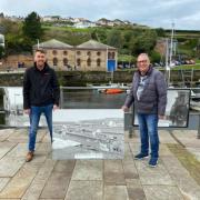 Deputy Mayor of Whitehaven Raymond Gill with Dean Hodgson of Canon. Replacing an outdoor photo exhibtion on Whitehaven Harbour