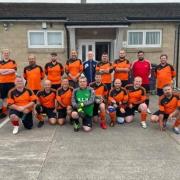 CHARITY: Kevin Young (centre) with the Tubby FC team