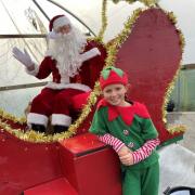 Santa and his elves at the Christmas markets