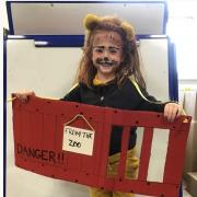 A pupil at Bransty Primary School dressed up as the lion from 'Dear Zoo'