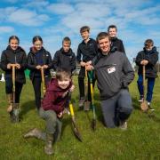 Angus Walsh with St Benedict's Students at one of the tree planting sessions earlier this term