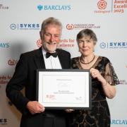 Peter and Iona receiving the award