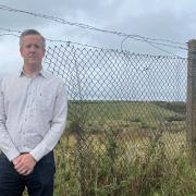 Conservative candidate Andrew Johnston at the site of the proposed coal mine in Whitehaven
