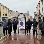 Traders from W Fare Ltd Pharmacy, The Bird Shack, McDowell's newsagents, and Wils Hambling butchers with councillor Edwin Dinsdale at the Market Place