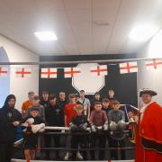 Kevin O' Fee (Left) and town crier, Marc Goodwin, with the young people at the gym