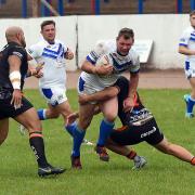 STAND-OUT: Workington Town’s Danny Tickle on a drive against Hunslet	                                                      John Story